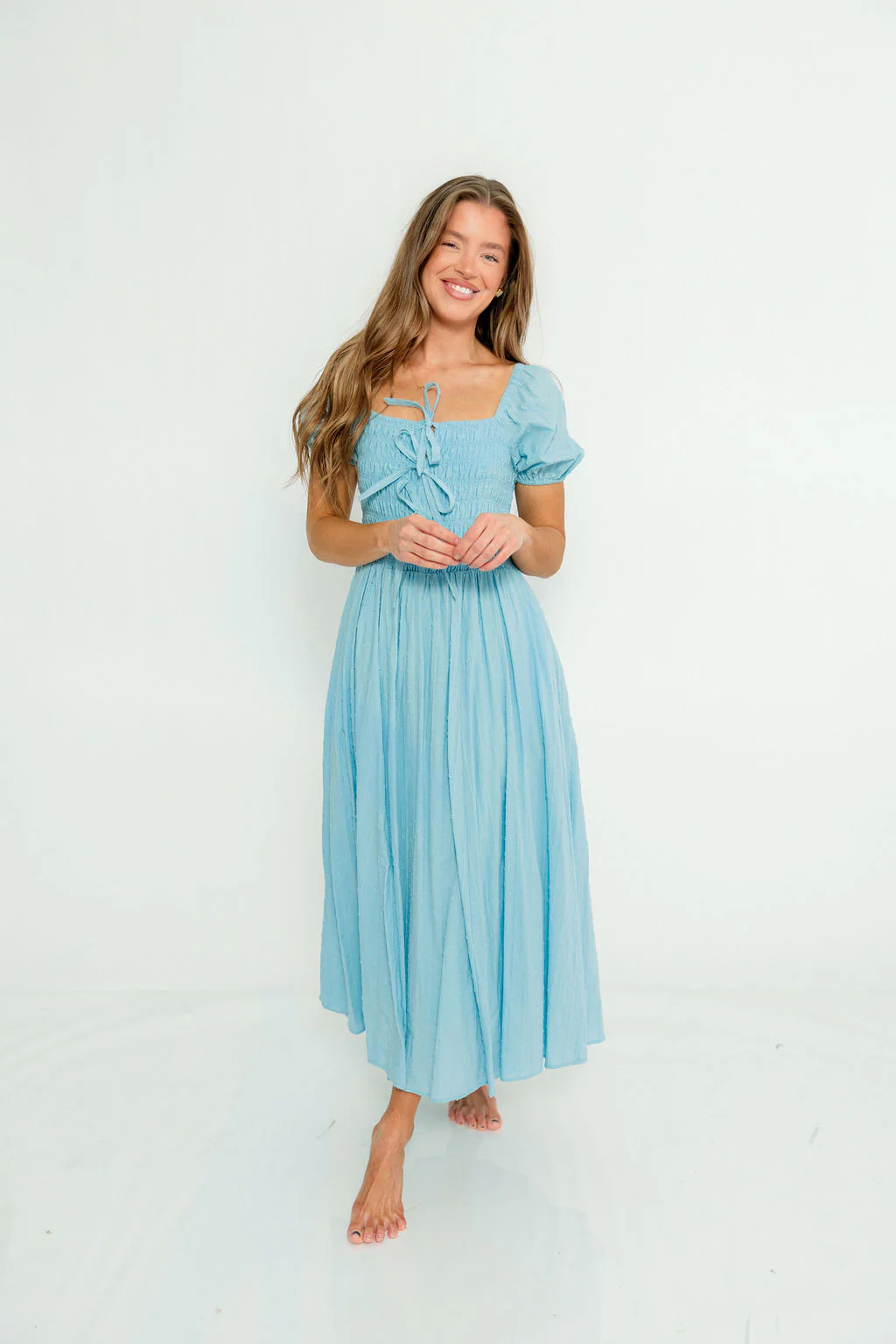 Arabelle Smocked Bow Detail Maxi Dress in Blue Aura
